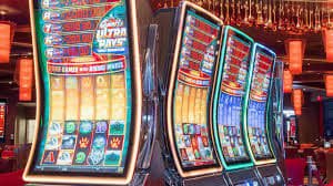 Filipino player accessing okeybet on a mobile phone for sports betting and casino games